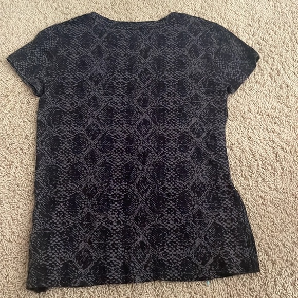 This is an Athleta Shirt. It can be used for exercise and casual wear. - Picture 2 of 3